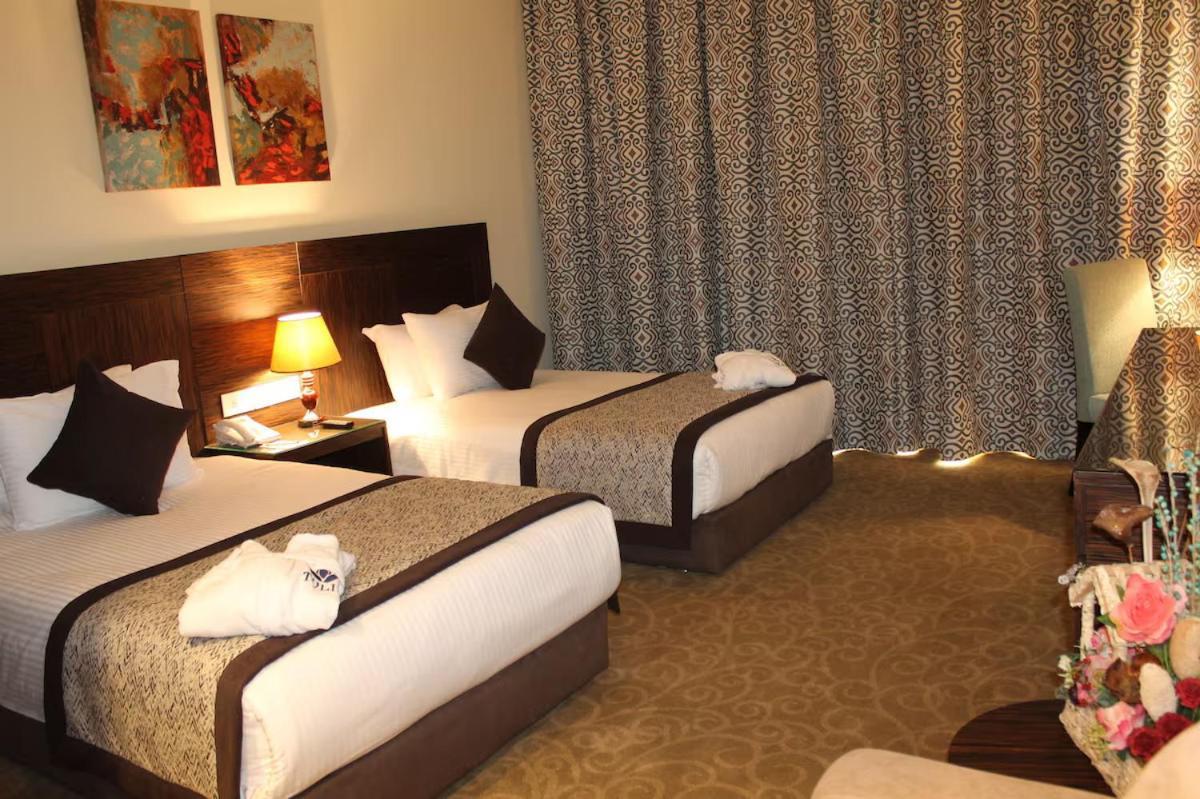 איסמעליה Tolip El Forsan Hotel מראה חיצוני תמונה A room at the hotel